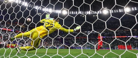 Hwang Hee-chan scores the penalty that secured South Korea’s victory.