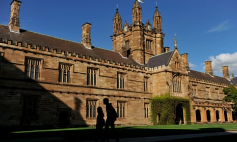 Students walk through the quadrangle at the University of Sydney.