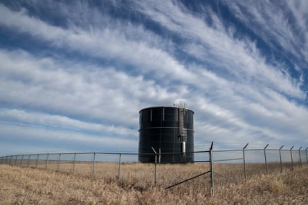 A Mni Wiconi water tank sits on a hill above Kyle, South Dakota, on the Pine Ridge Indian Reservation