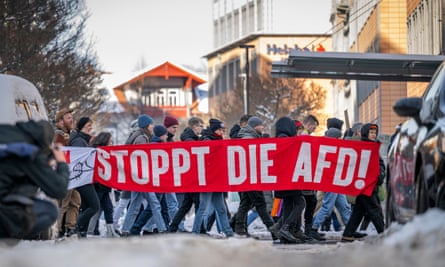 Protesters walking with a banner that reads: ‘Stop the AfD!’ in Erfurt in January.