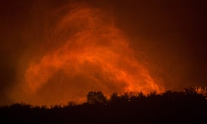 A whirlwind of embers as a wildfire approaches homes in Montecito, California.