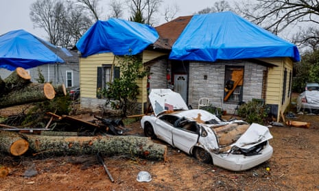 A destroyed car in front of severely damaged homes after a tornado in Griffin, Georgia, US, on Wednesday