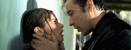 Close-up of the pair as Cusack puts his hands on either side of Peet’s jawline
