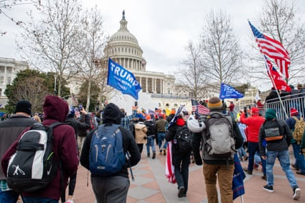 Trump supporters break through barricades on their way to the Capitol Building on 6 January 2021