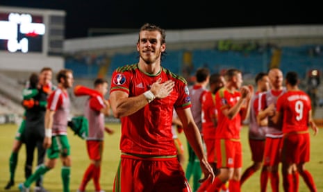 Gareth Bale celebrates with the fans at the end of the match.