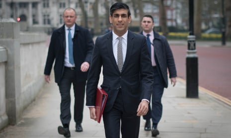 Rishi Sunak walks from the Treasury to No 11 Downing Street, London, the day before delivering his budget.