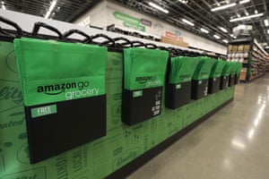 Inside Amazon’s new grocery store are reusable bags and tables meant for mid-shop sorting.