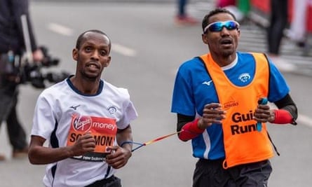 Avi Solomon (left) competing in London marathon