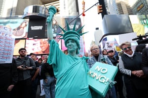 A person dressed in a Statue of Liberty costume at the No Kings protest in New York City.