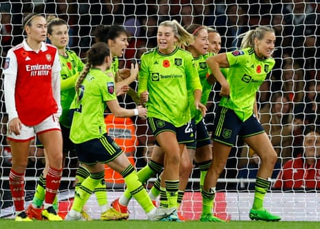 Manchester United's Millie Turner celebrates scoring her second goal with her teammates.