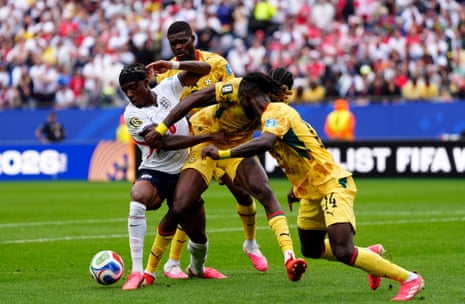 England's Noni Madueke takes on the Ghanaian defence.