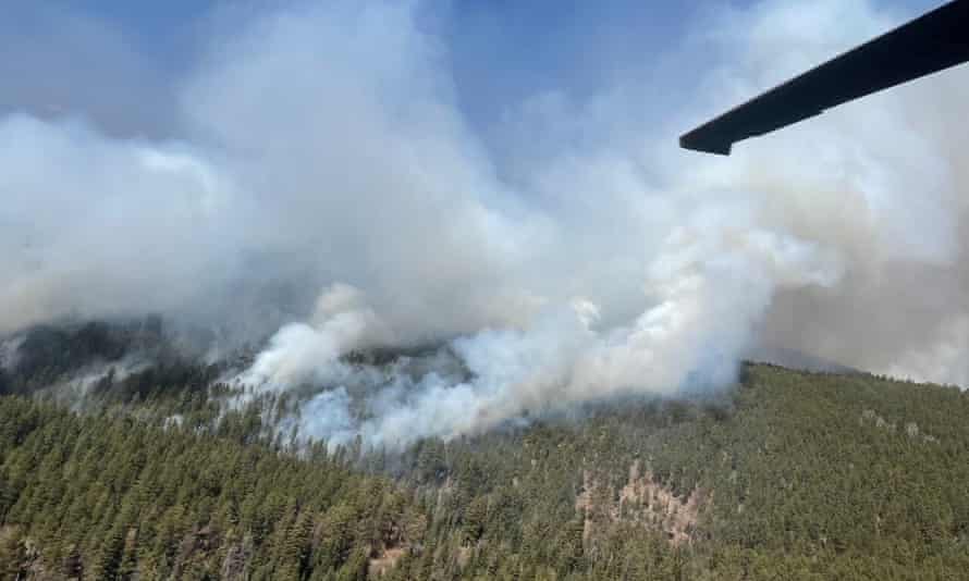 A Black Hawk helps firefighting efforts in New Mexico, dropping thousands of gallons of water.