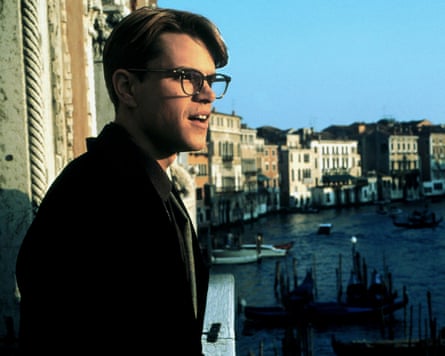 Man looks out over Venice canal