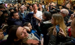 Mark Rutte, centre, calls for member of his campaign team to take his jacket during an election campaign stop in Barendrecht in 2017