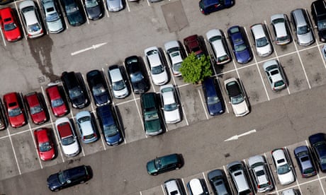 An aerial view of cars in a car park