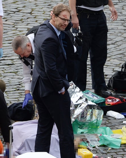 Tobias Ellwood at the scene outside the Palace of Westminster, London.
