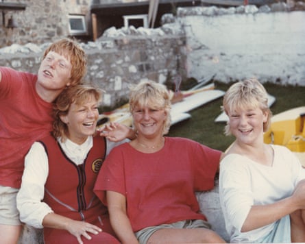 All are smiling for a family photo