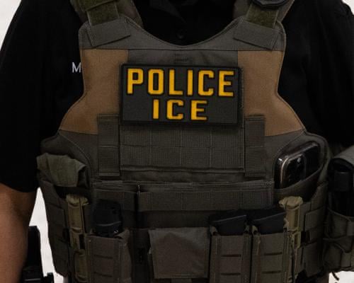 a tactical vest that says 'police ice'