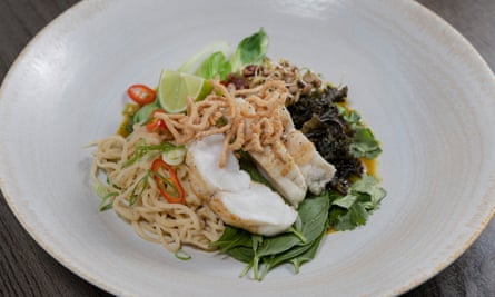 A bowl of monkfish broth with noodles.