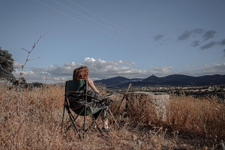 My grandmother sits in front of the well where her father’s remains were found