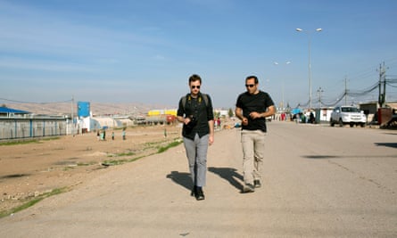 Garden designer Tom Massey (left) is shown around Domiz by Dr Sami Youssef, a biodiversity expert and former resident of the camp.
