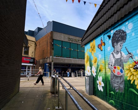 A mural on the side of a building in the town centre