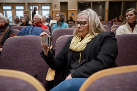 Chamberlain documenting a meeting on her phone.