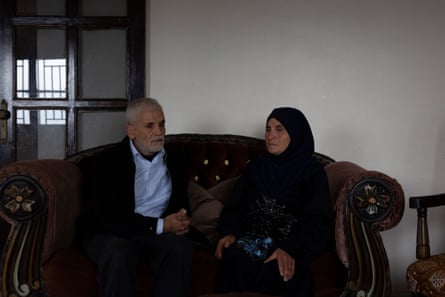Mohammed and Fatmeh Kanjo in the living room of their apartment in Akkar.