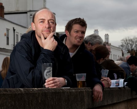 Daoust in a riverside pub watching the boat race, pint in hand