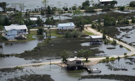 Receding storm waters surround homes in Keaton Beach, Florida, in the wake of Hurricane Idalia.