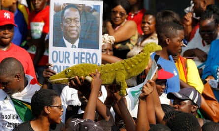 Thousands of people wait for the arrival of Emmerson Mnangagwa at an air force base in Harare on Wednesday.