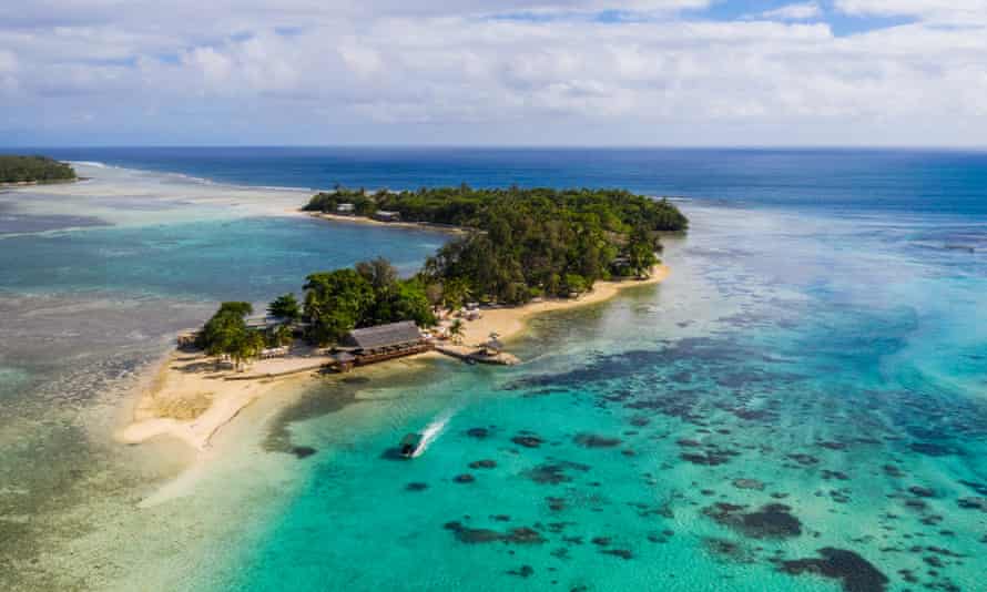 Aerial view of Erakor island in Port Vila, VanuatuAerial view of a boat carrying tourist to the stunning Erakor island in the Port Vila bay, just of Vanuatu capital city in the south Pacific on a sunny day.