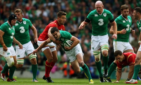 Ireland’s Jonny Sexton is tackled by Wales’s Rhys Webb.