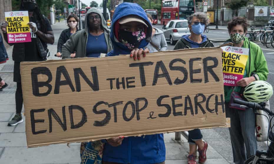 Protesters in London on 20 June call for the end of the use of police Tasers and stop and search.