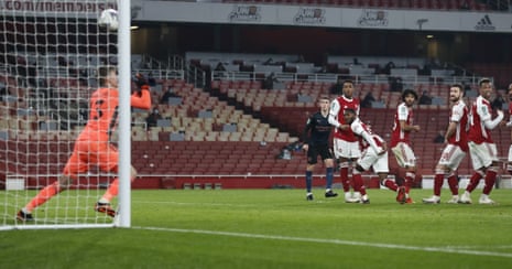 Players watch as Arsenal’s goalkeeper Runar Alex Runarsson lets the ball slip through his hands to give City back the lead.