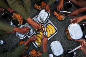 Trainees eat spiced garlic with their meal