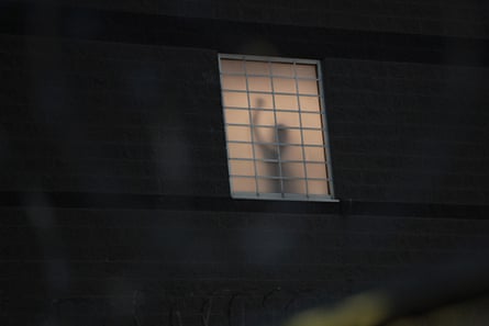 A detainee acknowledges protesters outside of Delaney Hall Immigration Detention Center on June 05, 2026 in Newark, New Jersey