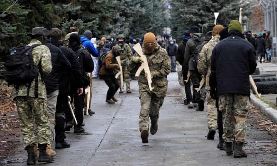 Ukrainians attend an open military training session for civilians in Kyiv.