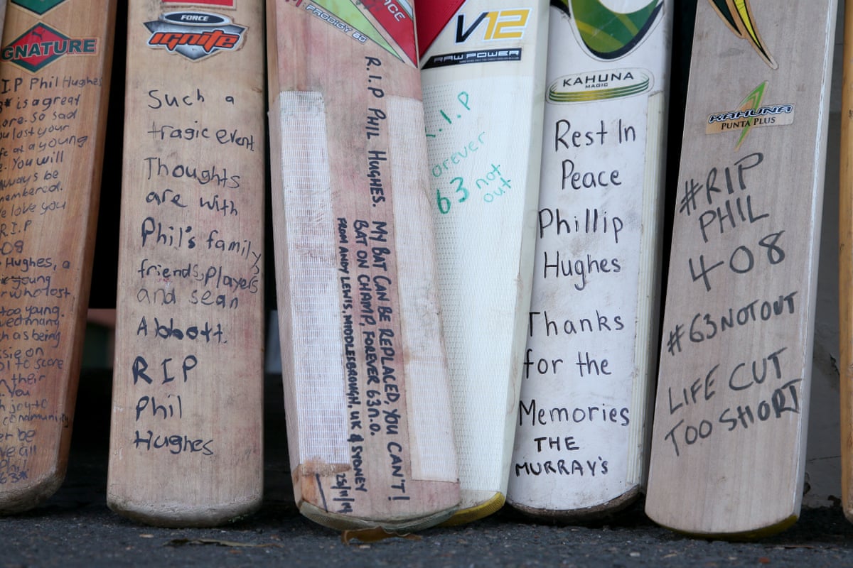 A row of bats are lined up outside Sydney Cricket Ground as a tribute for Phillip Hughes in 2014.