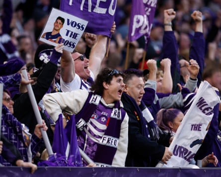 Fremantle Dockers fans celebrate at a match