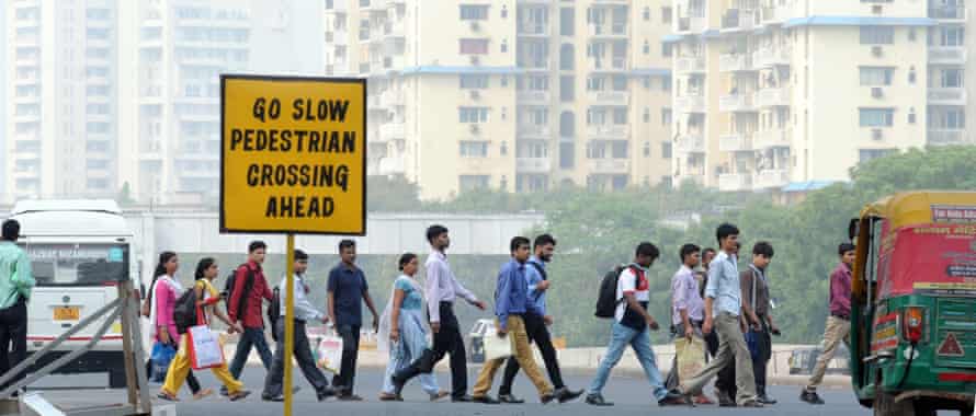 Employees on the way to the Cyber Hub in Gurgaon.
