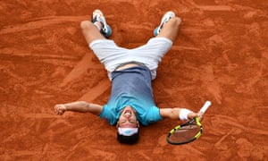 Marco Cecchinato celebrates his victory against Novak Djokovic after hitting a backhand winner.