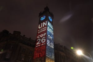 Projection on a tower of the words UN Cop26.