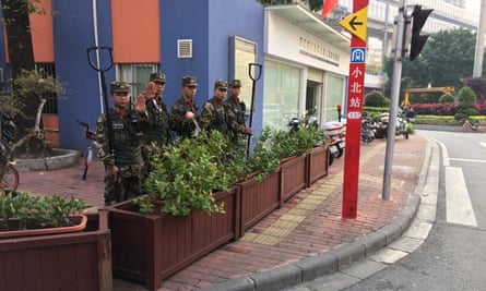 Chinese paramilitary police keep guard at the entrance to Little Africa on Guangzhou’s Baohan Street