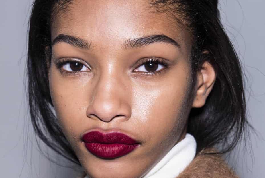 Seeing red: to make your lips the focus with matte red, keep other makeup to a minimum.