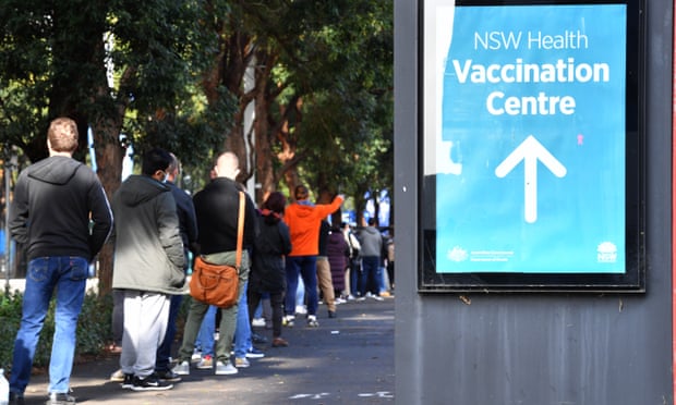 People queue outside a vaccination centre in Sydney