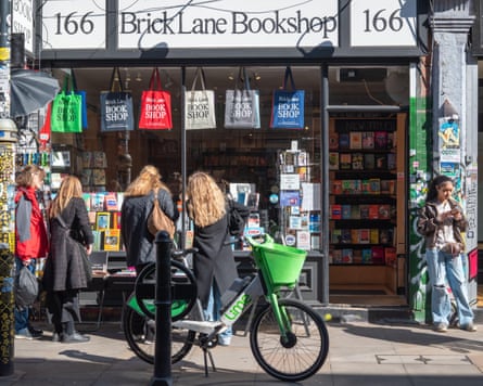 a Lime bike parked outside a boo store in Brick Lane