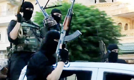 Isis fighters ride through Anbar province in Iraq brandishing machine guns in a propaganda video.