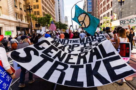 People march on Market St to Civic Center Plaza during a protest in San Francisco.