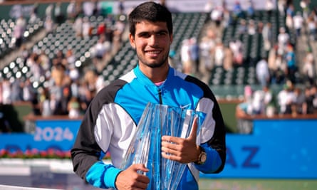 Carlos Alcaraz holds the trophy after winning his first tournament in eight months.